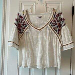 Anthropology bell- sleeve top with beautiful detail on front and back.